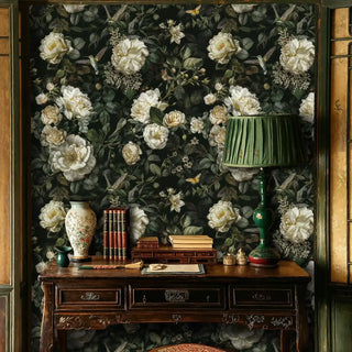 Garden wallpaper with cream blooms and birds displayed in classic library with green lamp