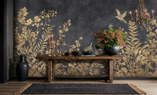 Gilded botanical wall mural with gold birds and ferns on charcoal, styled in elegant entryway with wood console