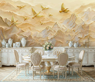 Gold relief mountain wall mural with flying birds, styled in a classic dining room with porcelain vases