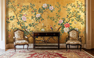 Golden bird and flower wall mural in classic entryway with matching upholstered chairs and console