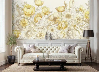 Golden botanical wall mural featuring layered blooms and foliage, shown in elegant living room with tufted sofa