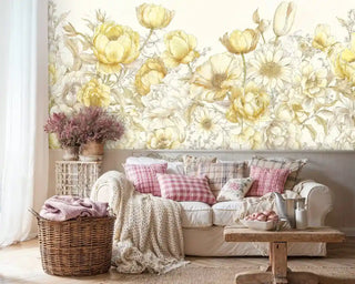 Golden botanical wall mural with mixed wildflowers and leaves, featured in cozy living room with wicker basket
