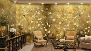 Golden botanical wall mural with white blooms and colorful birds in luxurious living room with gold furniture