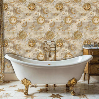Golden celestial pattern wallpaper featuring suns and moons shown in luxurious bathroom with white clawfoot bathtub