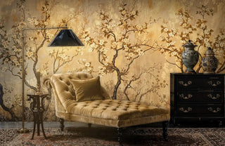 Golden chinoiserie Wall Mural featuring delicate blossoms shown in luxury living room with tufted chaise lounge