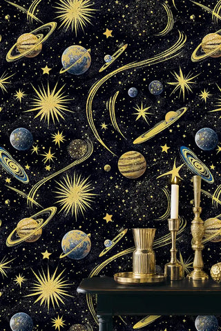 Golden cosmic wallpaper with celestial motifs, shown in sophisticated room with ornate brass candleholders