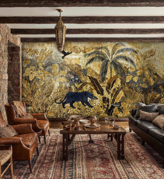 Golden jungle wall mural with prowling panther shown in rustic living room with leather chairs and stone fireplace