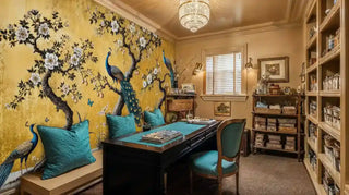 Golden peacock garden wallpaper in sophisticated home office with built-in bookshelves
