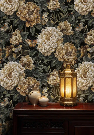 Golden peony wallpaper with butterflies on black background, styled in elegant interior with brass lantern and ceramic vases