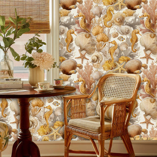 Golden seahorse and shell wallpaper displayed in dining area with rattan chair and wooden table