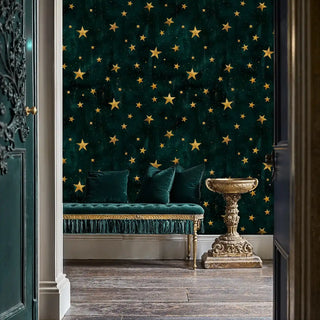 Golden stars on teal wallpaper creating celestial atmosphere in elegant sitting room
