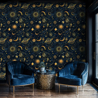Golden sun and moon wallpaper on navy background styled in modern seating area with perforated side table
