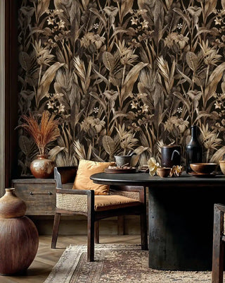 Golden tropical wallpaper with palm fronds and lilies, shown in rustic dining space with woven chair
