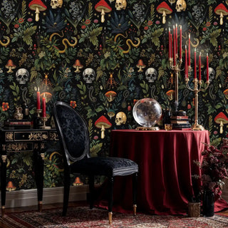gothic botanical wallpaper featuring skulls and serpents in elegant dining room with candelabra