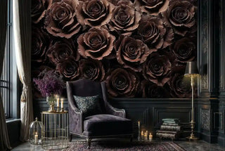Gothic botanical wallpaper with dark roses in sophisticated study with wingback chair and candles