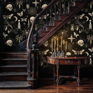 Gothic elements wallpaper with spider webs and candles displayed in grand foyer with wooden staircase