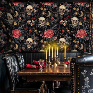 Gothic floral wallpaper with skulls and peonies in atmospheric dining space with leather banquette seating