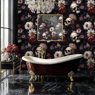 Gothic skull and floral wallpaper in a luxury bathroom featuring a clawfoot tub and a large crystal chandelier.