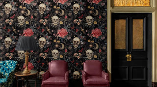 Gothic wallpaper featuring skulls and blooms in luxurious sitting room with burgundy leather chairs