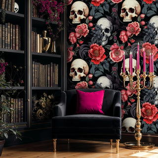 Gothic wallpaper with skulls and peonies displayed in sophisticated study with leather armchair and bookshelf