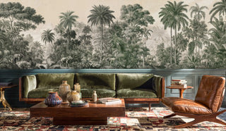 Green jungle wall mural with elephants and tropical foliage, displayed in a mid-century room with olive velvet sofa