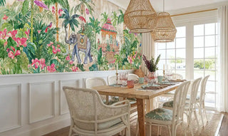 Indian elephant garden wallpaper with tropical birds in dining room with wicker pendant lights