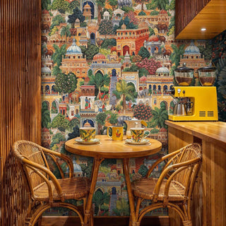 Indian palace garden wallpaper featuring domes and wildlife in modern kitchen breakfast nook with rattan chairs