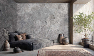 Industrial concrete texture wall mural with natural weathering and cracks in warm grey tones, shown in minimalist bedroom
