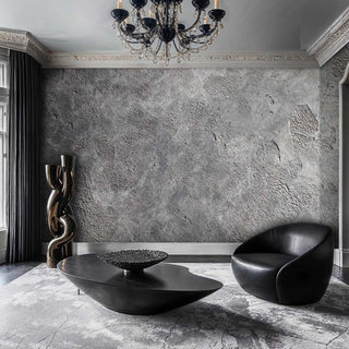 Industrial concrete texture wallpaper with natural imperfections in grey, featured in elegant living room with chandelier