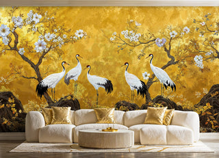 Japanese crane wall mural in gold with flowering branches, shown in a luxe living room with cream sofa