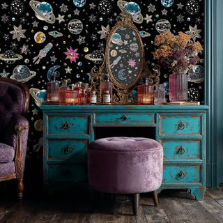 Jeweled galaxy wallpaper with diamond planets and stars, shown with vintage turquoise vanity and ornate mirror