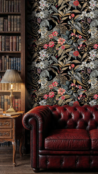 Jungle leopard wallpaper with coral flowers and silver foliage, shown in traditional study with bookshelf