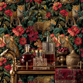 Jungle leopard wallpaper with red hibiscus flowers, styled in elegant dining room with brass bar cart