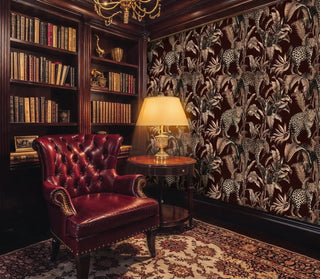 leopard jungle wallpaper, sepia palms on burgundy, with bookshelves and leather chair