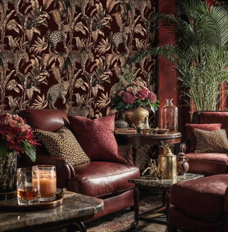 leopard jungle wallpaper, sepia palms on burgundy, with brass teapot on table