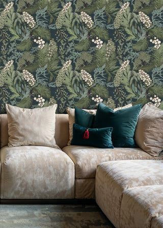 Lush botanical berry wallpaper on teal background, styled in living room with beige sectional sofa