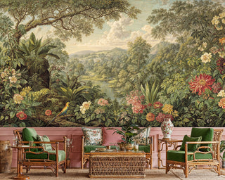 Lush tropical wallpaper with exotic birds shown in sunroom with bamboo furniture and green velvet chairs