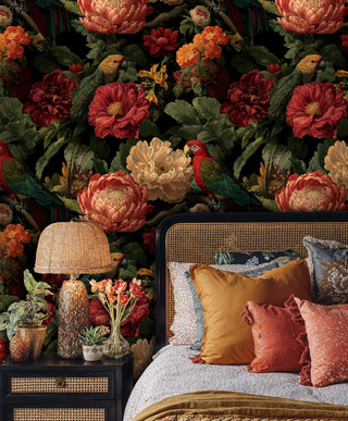 Luxurious tropical bird wallpaper with vibrant blooms, showcased in bedroom with cane headboard
