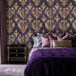 Luxury baroque wallpaper with gold scrollwork on purple background, shown in elegant bedroom with velvet bedding