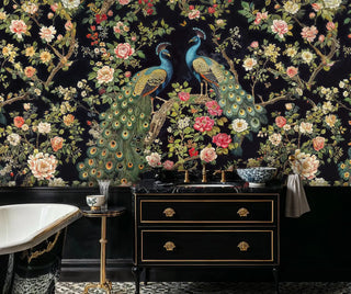 Luxury floral bird wallpaper in black and teal, featured in opulent bathroom with clawfoot tub and brass fixtures