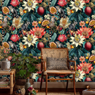 Madagascar-inspired wallpaper featuring lemurs among tropical blooms in a vintage study with cane chair