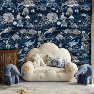 Marine life wallpaper with whales and sea shells, featured in kids room with cream cloud chair
