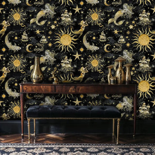 Maritime celestial wallpaper featuring suns and sea creatures in elegant room with wooden console table