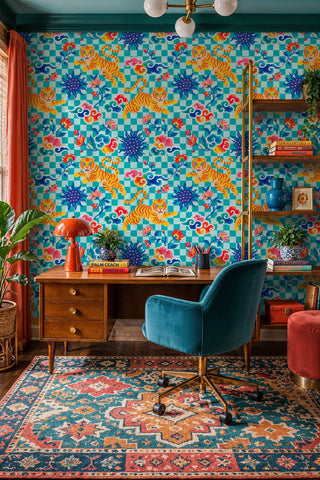 Maximalist tiger wallpaper with sun medallions and florals on teal, in a home office with wooden desk