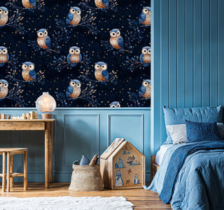 Midnight owl wallpaper featuring celestial pattern with golden stars, displayed in blue-themed kids room