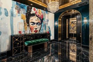 Mixed media portrait wall mural featuring vibrant florals and newsprint, displayed in elegant entryway with emerald bench