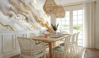 Modern marble wallpaper with gold veining in contemporary dining space with wicker pendant lights
