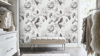 Monochrome rose wallpaper with detailed petals, displayed in luxury walk-in closet with tufted bench