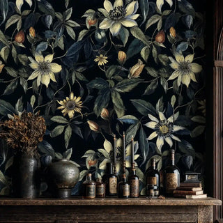 Moody floral clematis wallpaper featuring delicate cream blooms, displayed in elegant room with vintage bottles