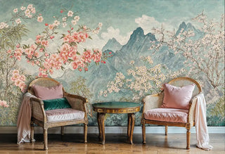 Mountain cherry blossom wallpaper shown in elegant sitting area with cane bergère chairs and round side table